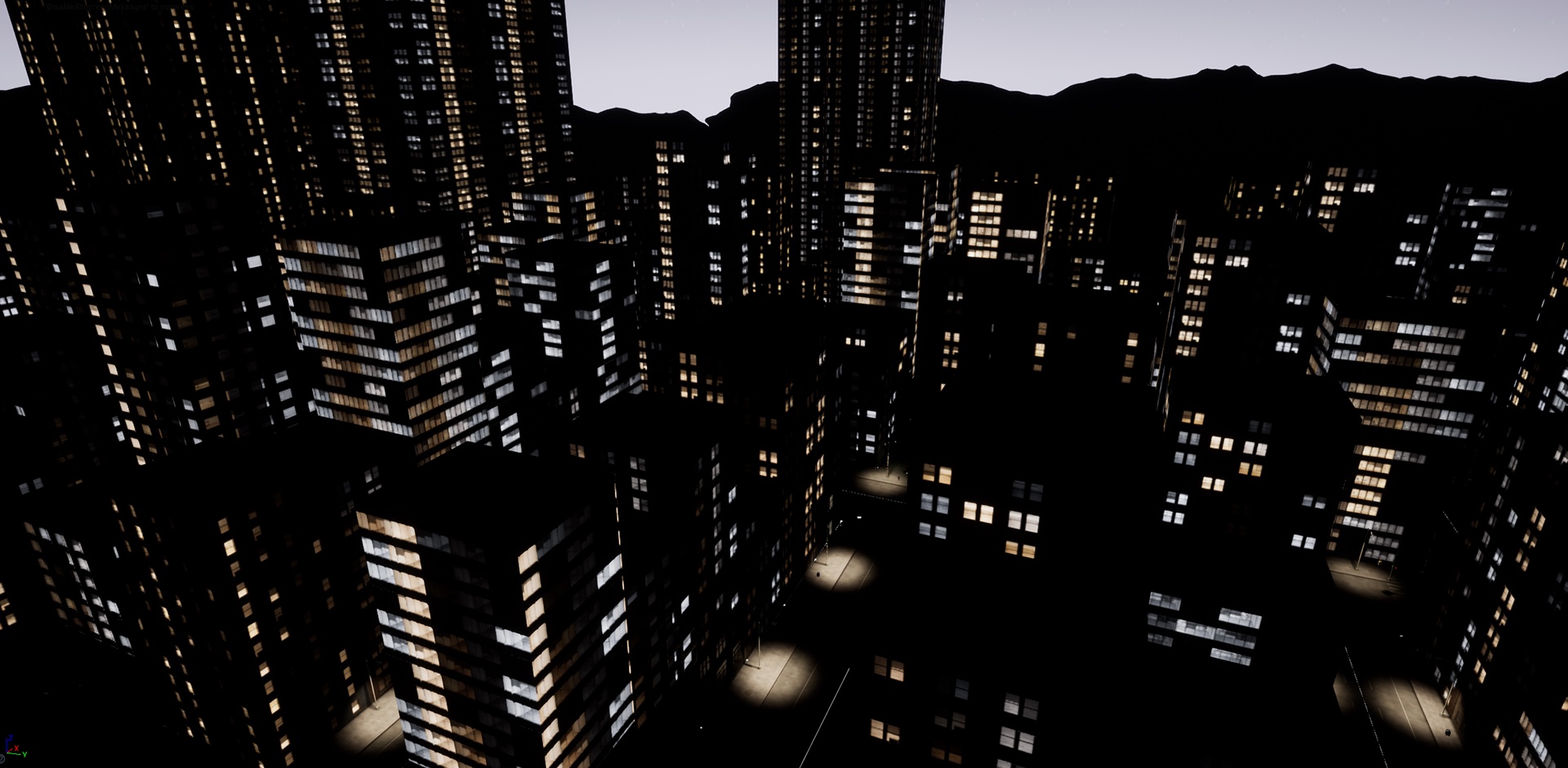 A night skyline: dark towers with scattered lit windows, viewed from above.